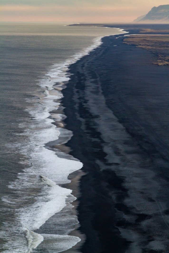 View from Dyrhólaey lighthouse along the black sandy coast towards Selfoss