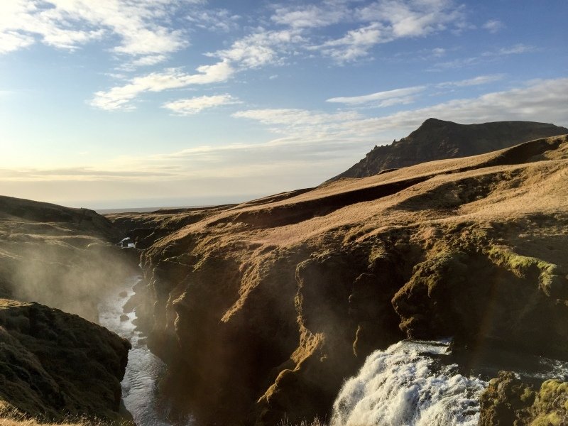 Walking along the Skógá River up from Skógafoss. A lovely warm day with the sounds of water intermittent as the river ducked deep into the earth and back out again and with the mist shooting up in the distance to signal the location of the next waterfall