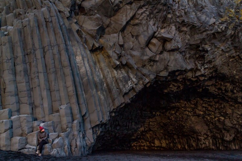Sunset in the basalt cave on the coast next to the Reynisdrangar